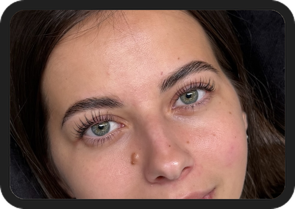 Face with styled brows and lashes at Hera's Beauty Salon